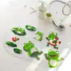 Badkarsmatta för barn med grön grodor och havsdjur, transparent med antiskridande yta.