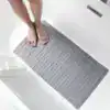 Grå badkarsmatta med loofah-textur, idealisk för badrummet och säkerhet vid badkar.