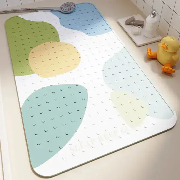 Badmatta för barn med antimögel egenskaper, färgglad design med blå, grön och gul, texturerad yta för säkerhet i badrummet.