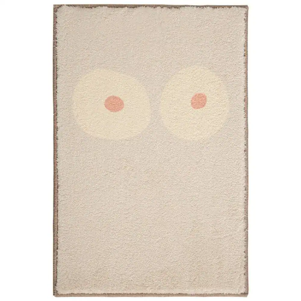Abstrakt konst badrumsmatta med pastellfärgade cirklar i beige och rosa.