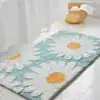 Badrumsmatta med blommor i turkos och vit, mjuk och färgglad för badrummet.