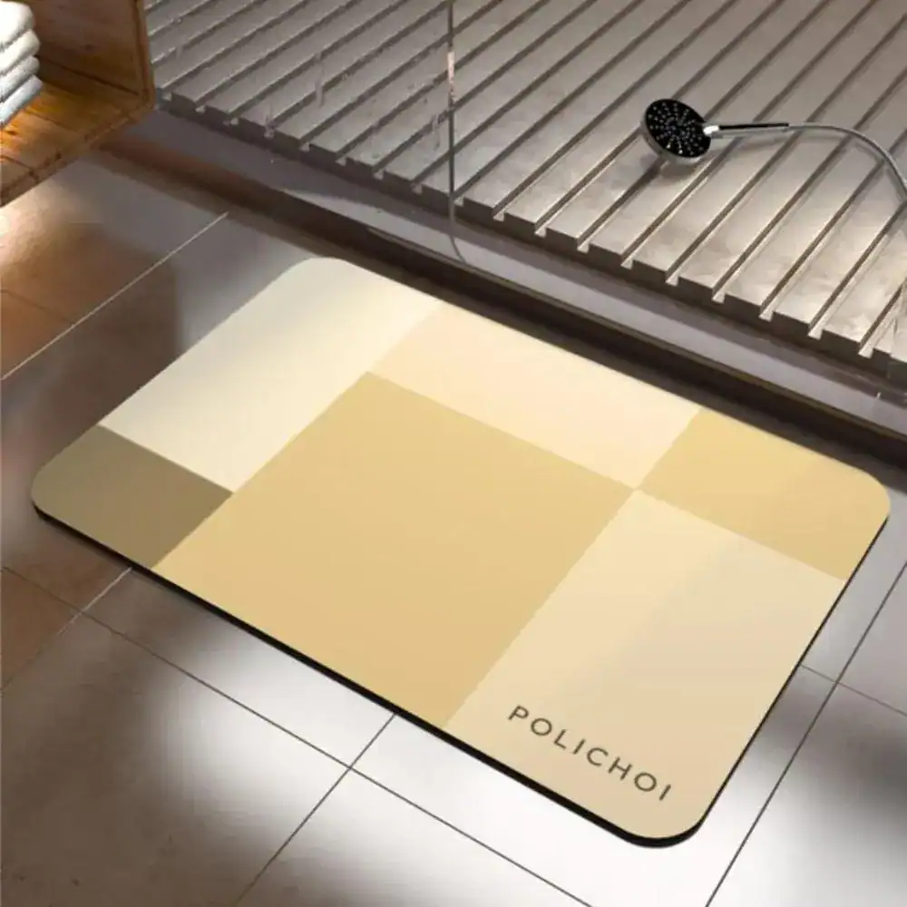 Badrumsmatta Diatomit Blå med geometriskt mönster i beige och guldtoner, idealisk för badrummet.