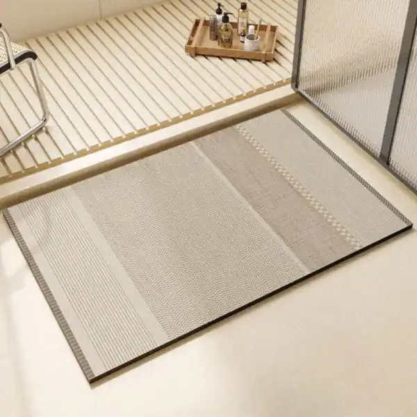 Diatomit badrumsmatta med tvåfärgad mönster i beige och grått, idealisk för badrummet.
