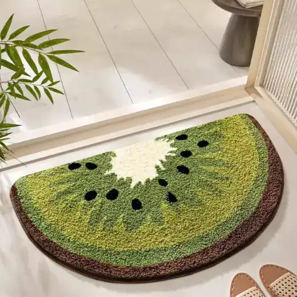 Badrumsmatta Kiwi i form av kiwifruktskiva, grön och svart, idealisk för badrummet.