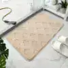 Badrumsmatta mikrofiber beige med rutig textur, idealisk för badrummet.