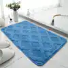 Blå mikrofiber badrumsmatta med rutig textur, idealisk för badrummet.