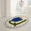 Oval badrumsmatta med blå tulpan, vit bakgrund och blå rand, badrumsmatta för badrum.