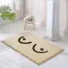 Badrumsmatta med leende ansikte, beige och svart, mjuk och rolig konst för badrum.