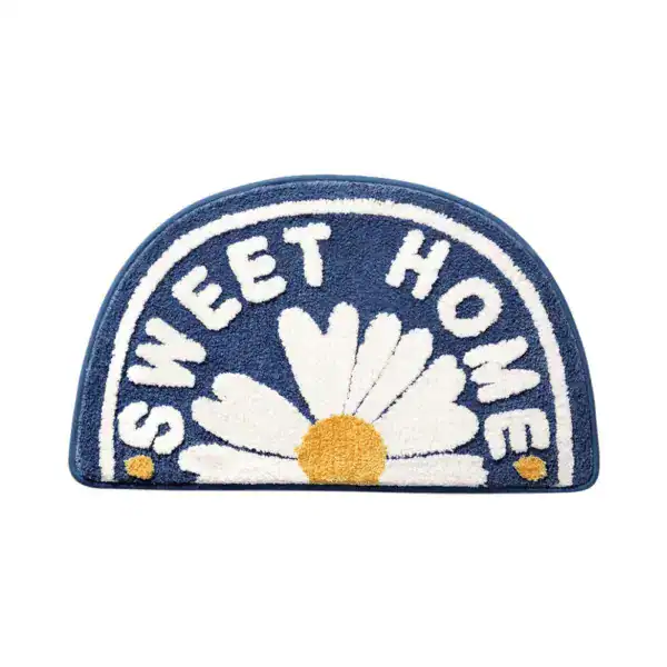 Badrumsmatta Sweet Home med blomma och text, blå färg, halvcirkel.