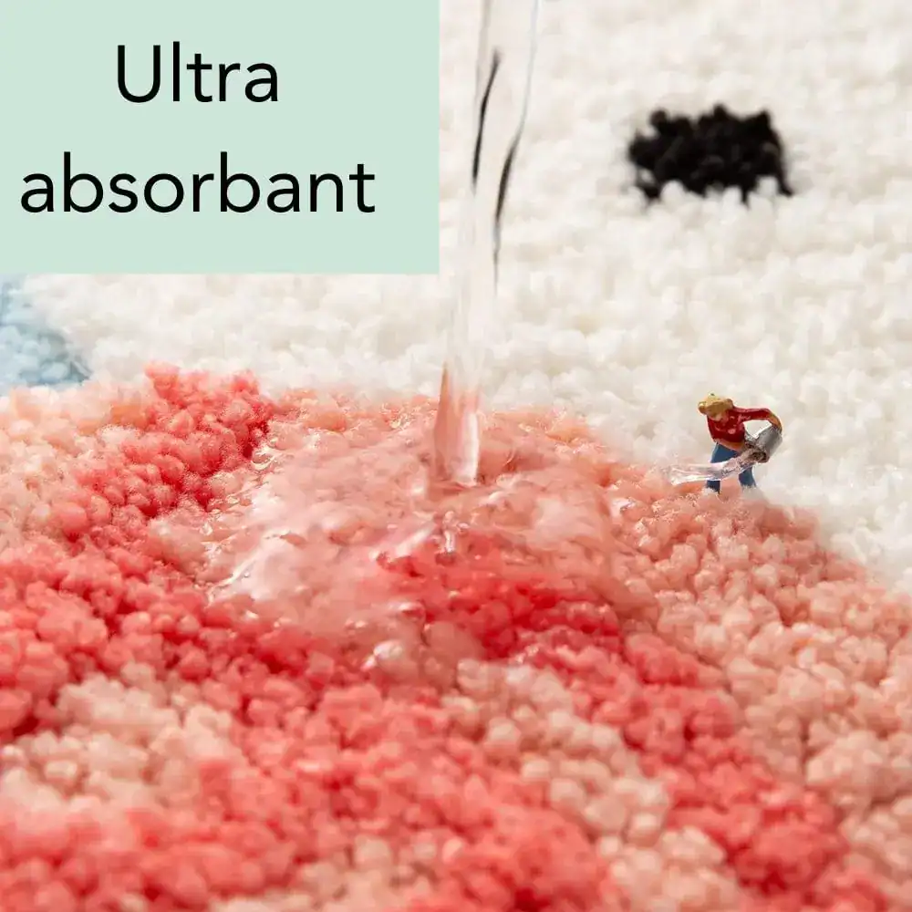 Ultraabsorbent badmatta för barn, färgglad och mjuk, visar vattentäckning i röd och vit ton.